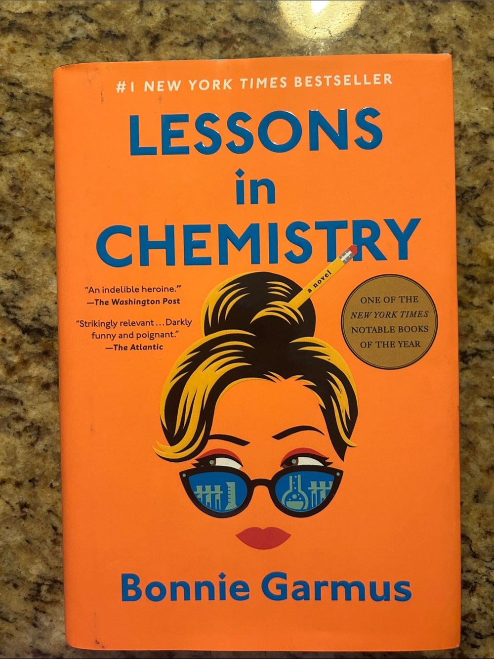 Lessons in Chemistry by Bonnie Garmus — Orange Hardcover Novel